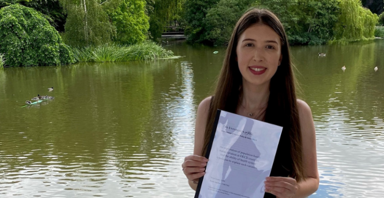 young woman holding her dissertation