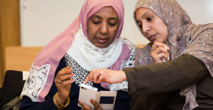 Two women using a smartphone