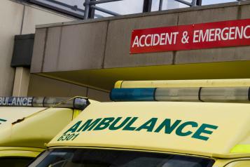 A fleet of ambulances parked outside and accident and emergency unit