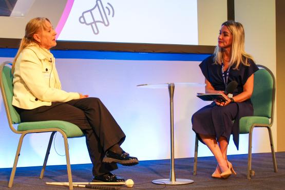 Vera Shilling being interviewed on stage by Caroline Tyrell-Jones